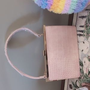 Classy pink clutch with gold accents and detachable long strap